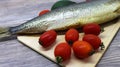 Fresh fish and vegetables on a cutting board Royalty Free Stock Photo