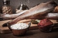 Fresh fish, vegetables, flour, tomatoe paste and spices on a woo Royalty Free Stock Photo