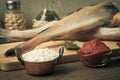 Fresh fish, vegetables, flour, tomatoe paste and spices on a woo Royalty Free Stock Photo