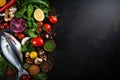 Fresh fish, vegetables and spices on black background. Top view with copy space, Healthy food background. Fresh vegetables, fish, Royalty Free Stock Photo