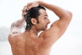 Fresh and fit. a handsome young man enjoying a refreshing shower. Royalty Free Stock Photo