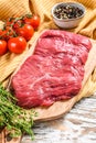 Fresh flank steak on a chopping Board. White background. Top view