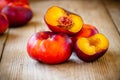 Fresh flat nectarines on a wooden background Royalty Free Stock Photo