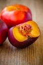 Fresh flat nectarines on a wooden background Royalty Free Stock Photo