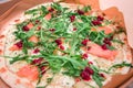 fresh and flavorful Italian pizza with salmon, arugula greens and spicy cranberry sauce. Quick and satisfying snack and