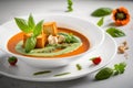 Fresh and flavorful tomato soup with pesto, basil, croutons, and a creamy texture served on a white table. Royalty Free Stock Photo