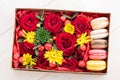 Fresh flower in box and macaroon Royalty Free Stock Photo