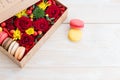 Fresh flower in box and macaroon Royalty Free Stock Photo