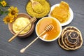 Fresh flower honey of different varieties, pollen and honeycomb with spoons on a wooden background. Organic Vitamin Health Food Royalty Free Stock Photo