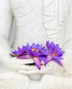 Fresh flowers in Buddha image hands Royalty Free Stock Photo