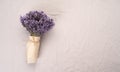 Fresh flowers of lavender bouquet on a white textured background. Flat lay, top view. Royalty Free Stock Photo