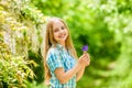 Fresh flowers. Summer is here. Kid hold flowers. Girl cute adorable teen nature background. Summer garden flower. Sunny