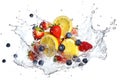 Fresh flying juicy berries and citrus fruits in drops and falling splashes Royalty Free Stock Photo