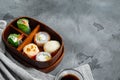 Fresh Food Portion in Japanese Bento Box with Sushi Rolls, on gray stone background , with copyspace  and space for text Royalty Free Stock Photo