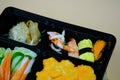 Fresh food portion in Japanese bento box with sushi rolls Royalty Free Stock Photo