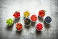 Fresh forest berries in the glasses. On stone table. Royalty Free Stock Photo