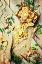 Fresh forest mushrooms chanterelles in a wicker basket, rustic s Royalty Free Stock Photo