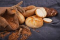 Fresh fragrant bread on the table. Food concept. Bakery, crusty loaves of bread and buns. Assortment of baked bread