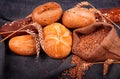 Fresh fragrant bread on the table. Food concept. Bakery, crusty loaves of bread and buns. Assortment of baked bread