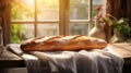 Fresh fragrant, still life with French baguettes from fresh bread with poolish on a wooden cutting board and wheat.n Royalty Free Stock Photo