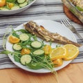Fresh fried fish with vegetables served on plate, closeup Royalty Free Stock Photo