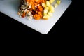 Fresh and frozen chopped vegetables,  Chopped carrots, potatoes, onions and red bell pepper on white cutting board Royalty Free Stock Photo