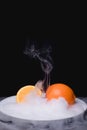 Orange and dry ice Royalty Free Stock Photo