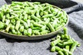Fresh frozen green beans in a plate. Stocking up vegetables for winter storage Royalty Free Stock Photo