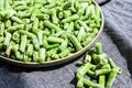 Fresh frozen green beans in a plate. Stocking up vegetables for winter storage Royalty Free Stock Photo