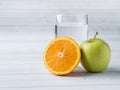 Fresh fruit Apple orange Cup of water on the table Diet Royalty Free Stock Photo