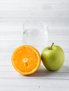 Fresh fruit Apple orange Cup of water on the table Diet Royalty Free Stock Photo