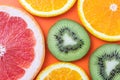 Fresh fruit background, citrus colorful pattern. Slice of kiwi, orange and grapefruit on bright background. Exotic tropical fruits Royalty Free Stock Photo