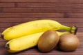 Fresh fruit banana and kiwi isolated on wooden background. Healthy food. A mix of fresh fruit. Group of citrus fruits. Vegetarian. Royalty Free Stock Photo