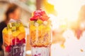 Fresh fruit cocktail finely chopped orange slices, strawberries, kiwi, yogurt, oatmeal. Concept health is refreshing and Royalty Free Stock Photo