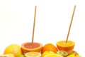 Fresh fruit cut in half with a drinking straw Royalty Free Stock Photo