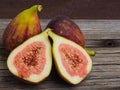 Fresh fruit figs on old boards, cut one of them in half Royalty Free Stock Photo