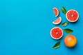 fresh Fruit grapefruit with Juicy grapefruit slices on colored background. Top view. Copy Space. creative summer concept Royalty Free Stock Photo