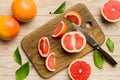 fresh Fruit grapefruit slices on colored background. Top view. Copy Space. creative summer concept. Half of citrus in Royalty Free Stock Photo