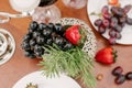Fresh fruit, grapes and strawberries in the table setting or decoration Royalty Free Stock Photo