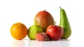 fresh fruit group - apple green and red, pear, mango and orange, lie on a white table, isolated Royalty Free Stock Photo