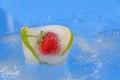Fresh fruit iced in a piece of ice