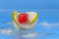 Fresh fruit iced in a piece of ice