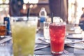 Fresh fruit juice with ice. Glass of watermelon juice on table in restaurant with bright background Royalty Free Stock Photo