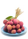 Fresh fruit lychee on blue ceramic tableware on white background Royalty Free Stock Photo