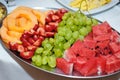 Fresh fruit melon strawberry pineapple and grapes