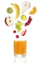 Fresh fruit over glass of multi vitamine juice Royalty Free Stock Photo