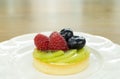 Fresh fruit pie tart with kiwi, blueberry, and raspberry Royalty Free Stock Photo