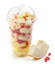 Fresh fruit pieces salad in plastic cup Royalty Free Stock Photo