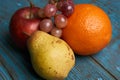 Fresh fruit red apple pear orange and grapes Royalty Free Stock Photo