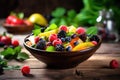 Fresh fruit salad in a bowl on wooden background. Selective focus, salad with fresh fruits and berries on wooden table, healthy Royalty Free Stock Photo